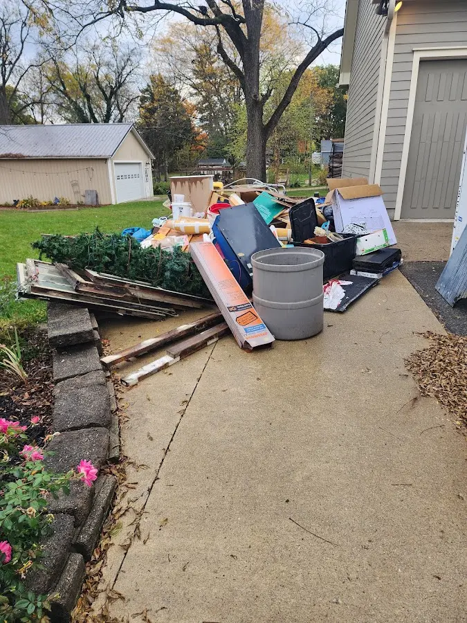 Dumpster being loaded with debris for 3 Yard Dumpster Rental in Desert Hot Springs